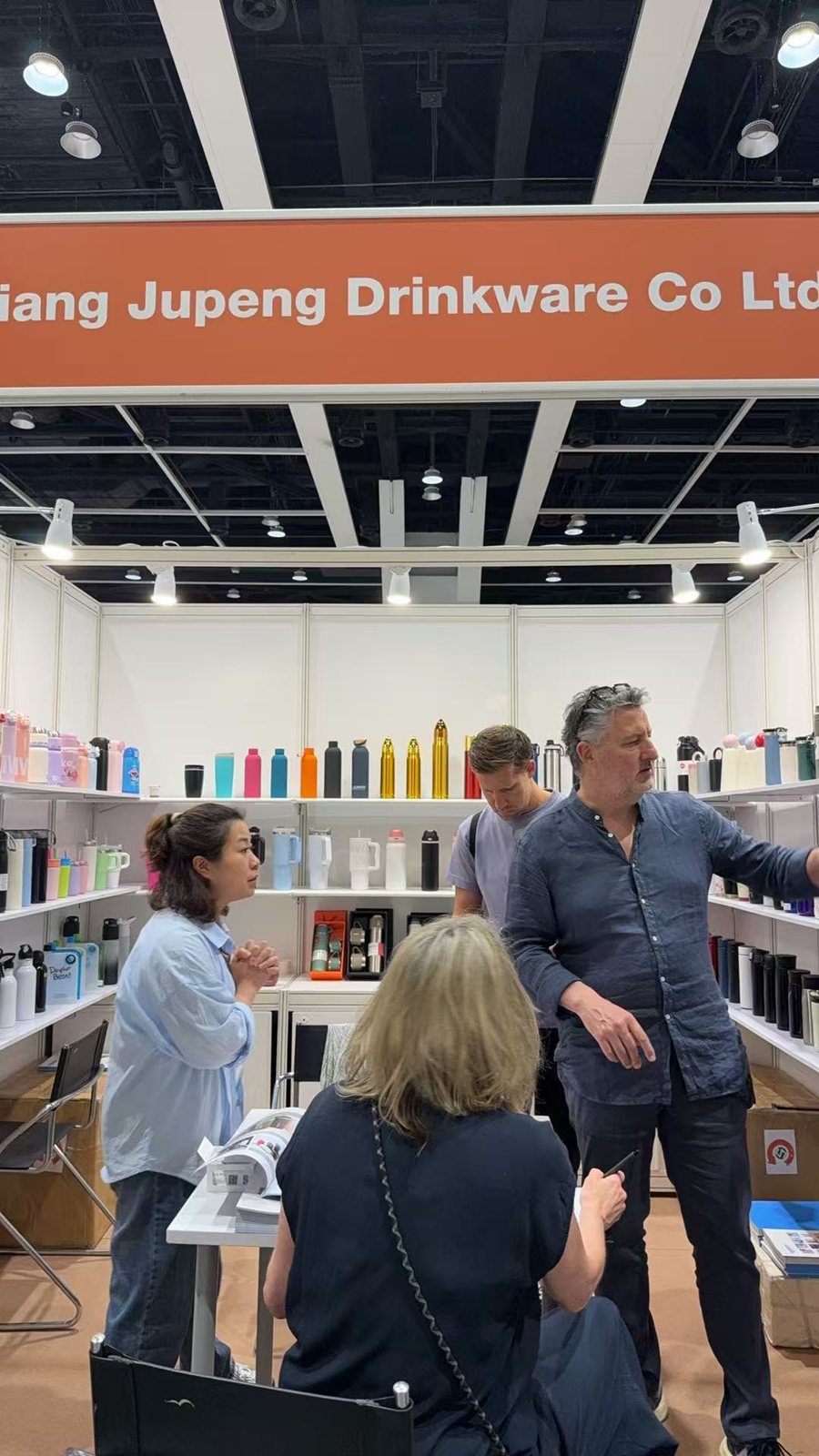 Miya Wu going through samples with buyers at the Jupeng booth, Hong Kong Mega Show