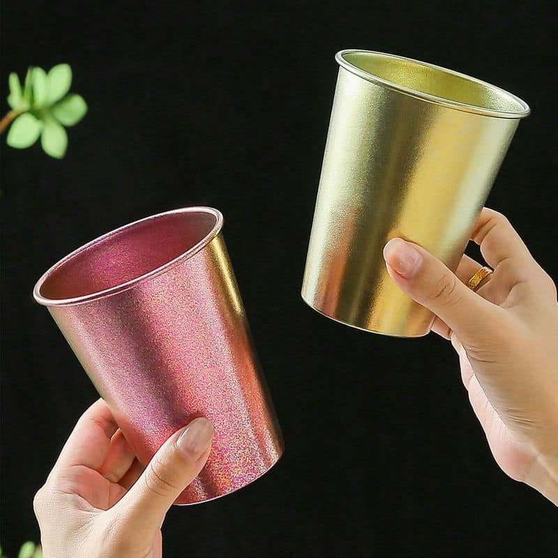 Single-wall pure titanium cups in rose and gold